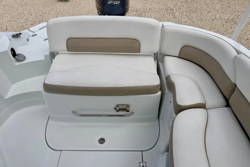 Slide: The Image of 2012 SouthWind 2600 SD boat interior with white and beige seating. - 25