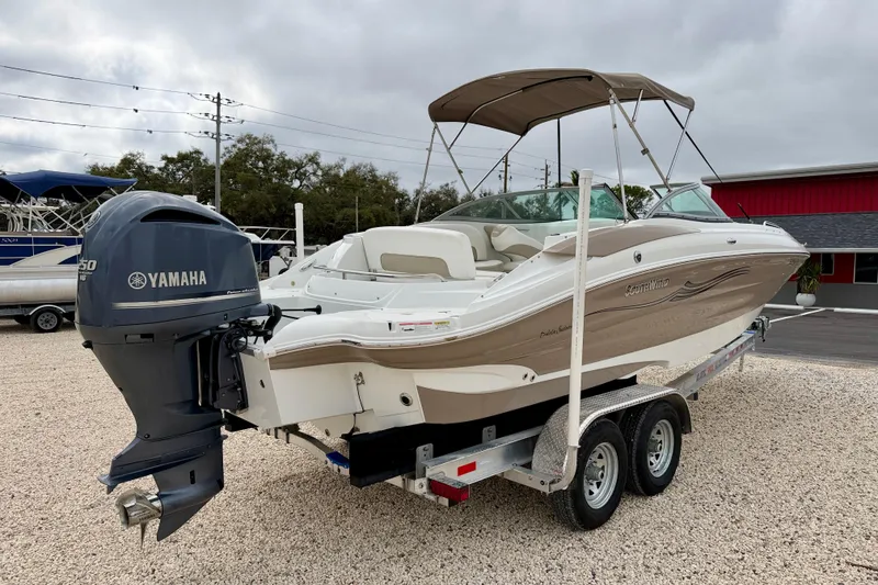 Slide: The Image of 2012 SouthWind 2600 SD boat with Yamaha engine on trailer, parked outdoors. - 5