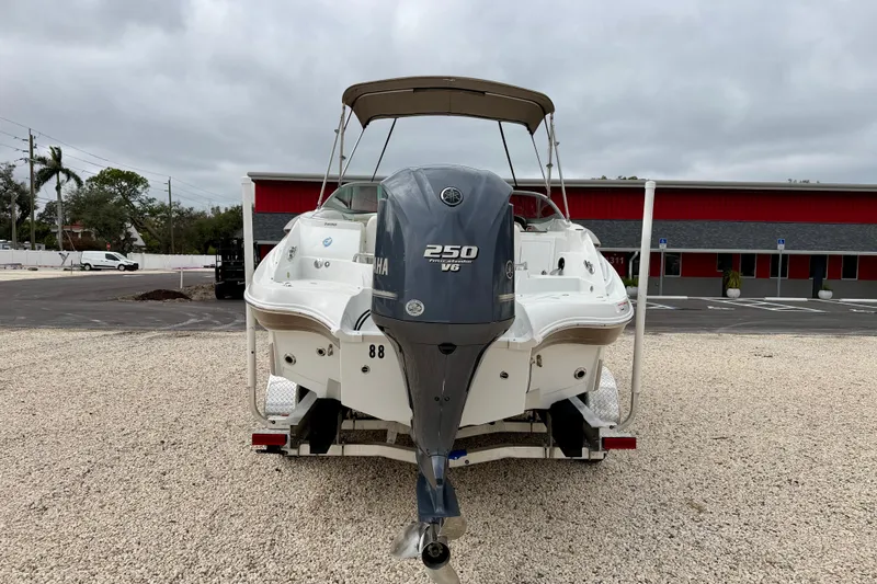 Slide: The Image of 2012 SouthWind 2600 SD boat with Yamaha 250 V6 engine, parked on gravel. - 6