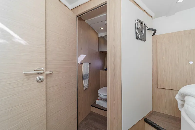 Slide: The Image of 2025 Beneteau Swift Trawler 41 bathroom interior with modern wood finish. - 29