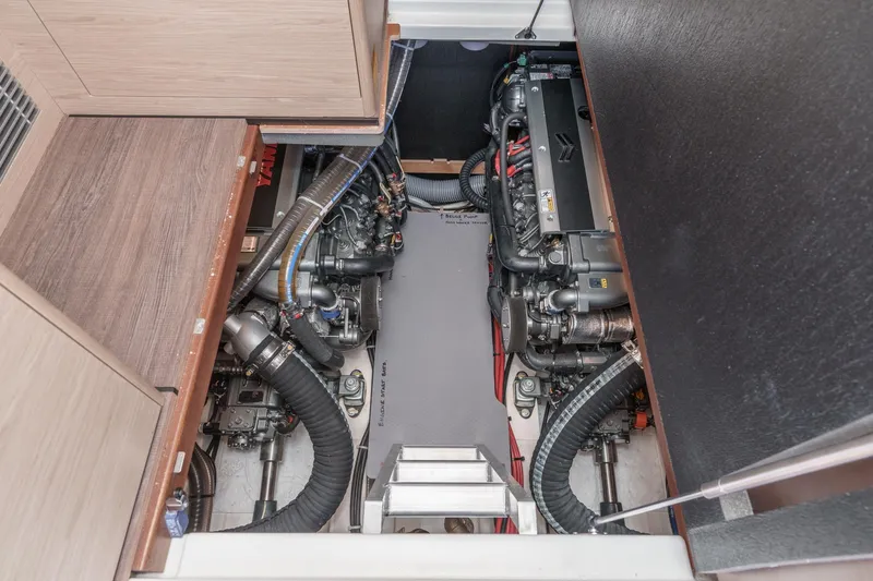 Slide: The Image of Engine room of 2025 Beneteau Swift Trawler 41, showcasing dual engines and mechanical components. - 50