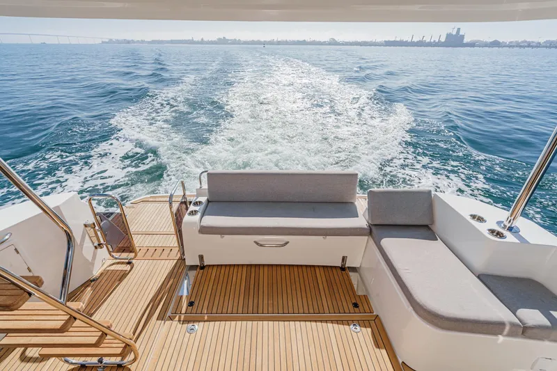 Slide: The Image of 2025 Beneteau Swift Trawler 41 cruising, showcasing elegant deck and ocean view. - 6