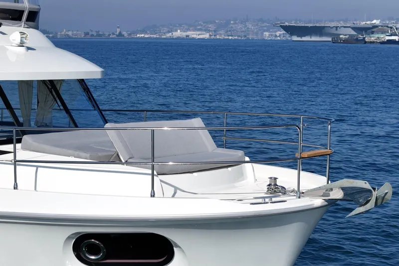 Slide: The Image of 2025 Beneteau Swift Trawler 41 yacht on calm blue sea. - 80