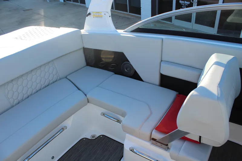 Slide: The Image of 2026 Four Winns H2 Freedom boat interior with white cushioned seating and modern design. - 11