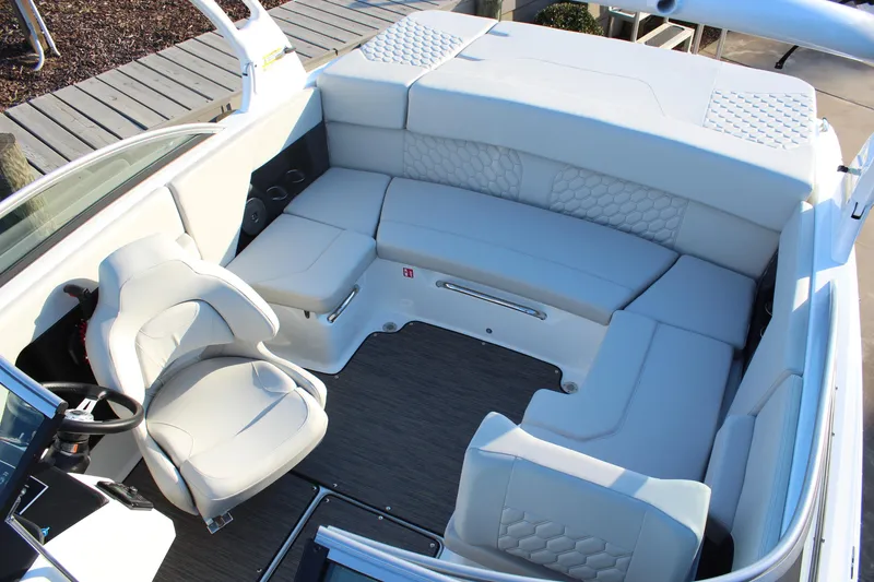 Slide: The Image of 2026 Four Winns H2 Freedom boat interior with white seating and modern design. - 14
