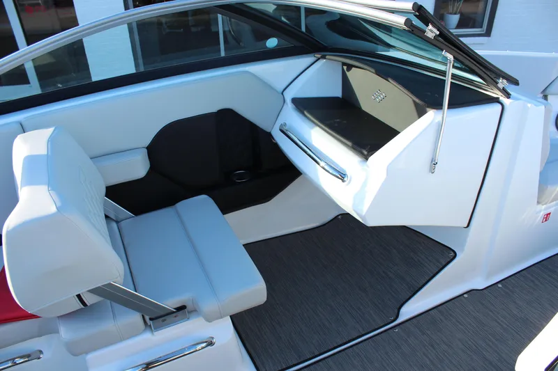 Slide: The Image of Interior of 2026 Four Winns H2 Freedom boat with modern seating and dashboard design. - 15