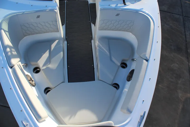 Slide: The Image of 2026 Four Winns H2 Freedom boat interior with gray seating and cup holders. - 20