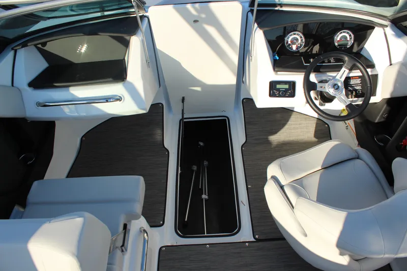 Slide: The Image of 2026 Four Winns H2 Freedom boat interior with modern dashboard and seating. - 22