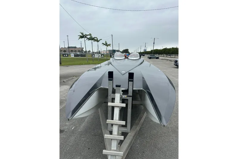 The Image of 2008 Motion Marine 35 XP boat on a trailer. - 0
