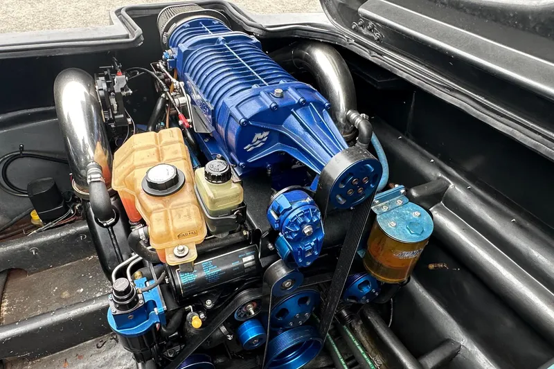 Slide: The Image of Engine compartment of a 2008 Motion Marine 35 XP boat. - 11