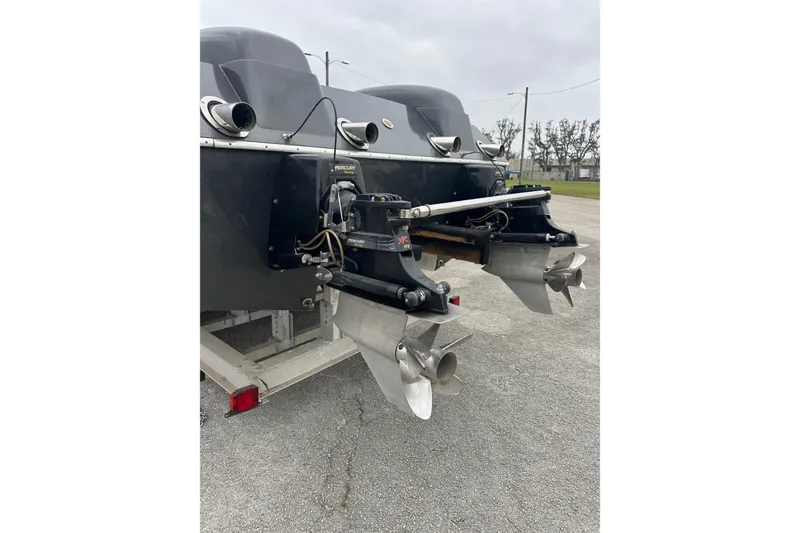 Slide: The Image of Rear view of a 2008 Motion Marine 35 XP boat with dual engines. - 2