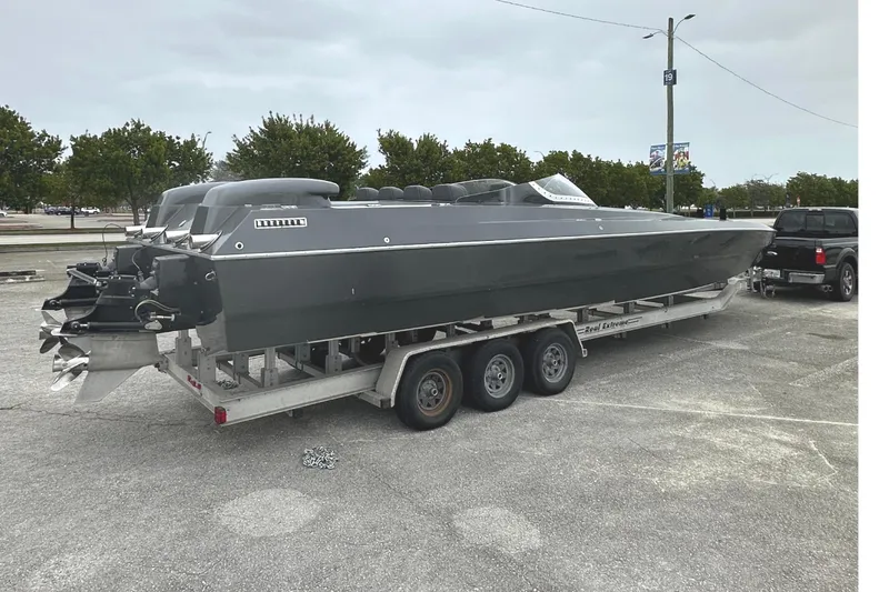 Slide: The Image of 2008 Motion Marine 35 XP on trailer parked outdoors. - 4