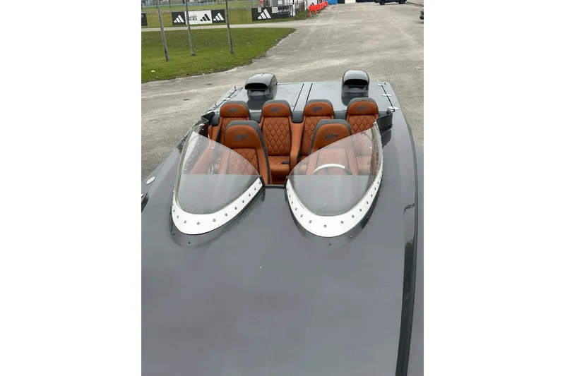 Slide: The Image of 2008 Motion Marine 35 XP boat with sleek design and luxurious seating. - 5