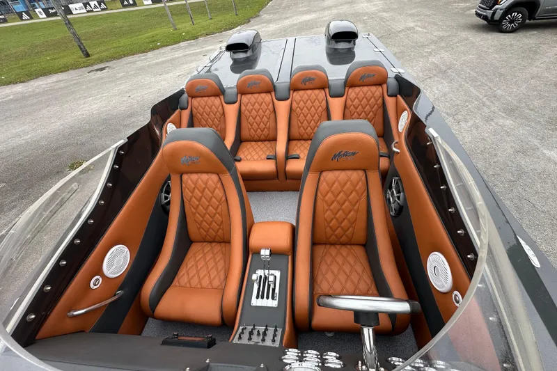 Slide: The Image of 2008 Motion Marine 35 XP boat interior with orange quilted seats and sleek design. - 6