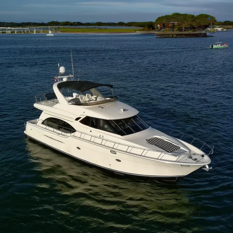 The Image of 2004 Meridian 580 Pilothouse yacht cruising on open water. - 0