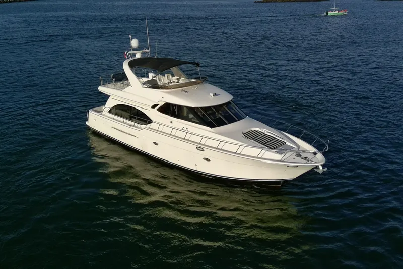 Slide: The Image of 2004 Meridian 580 Pilothouse yacht cruising on open water. - 1