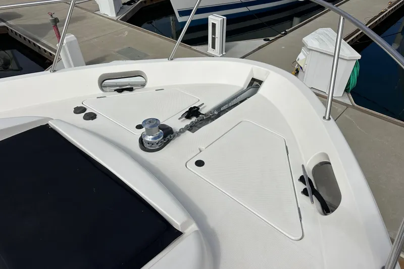 Slide: The Image of Bow deck of 2004 Meridian 580 Pilothouse yacht with anchor and winch system. - 100