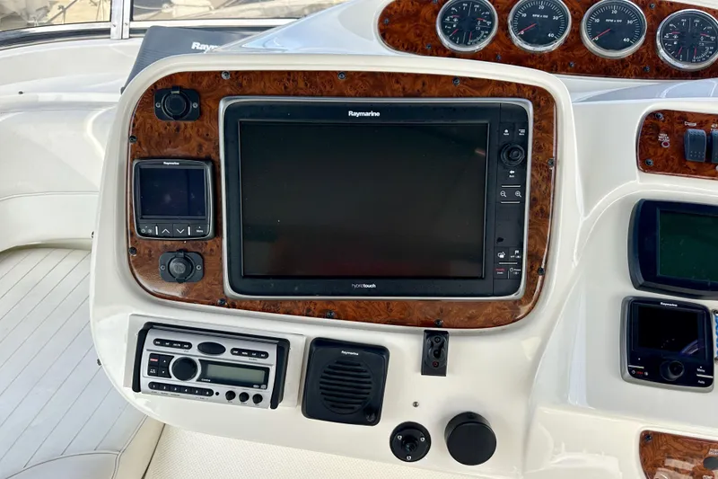Slide: The Image of Control panel of a 2004 Meridian 580 Pilothouse with navigation and communication systems. - 119