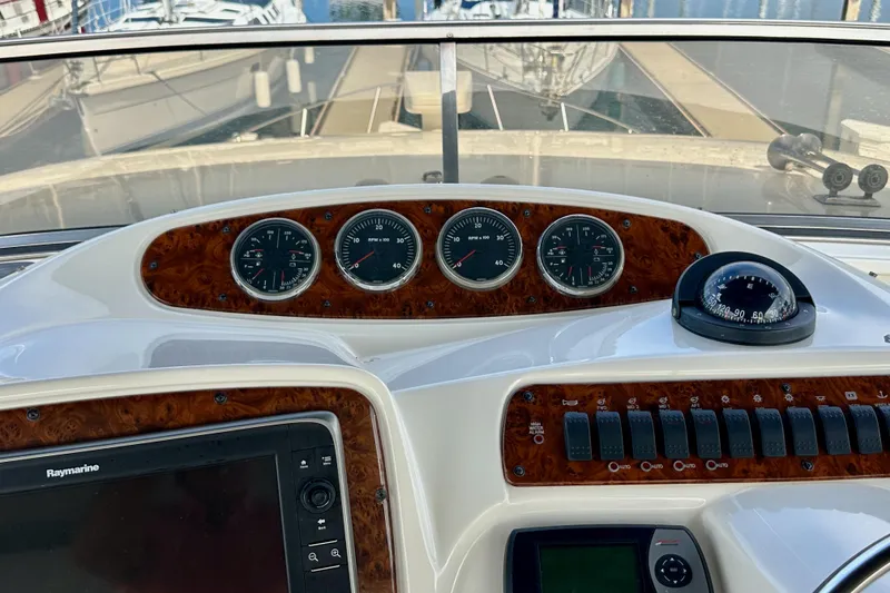 Slide: The Image of Control panel of a 2004 Meridian 580 Pilothouse yacht with gauges and compass. - 121