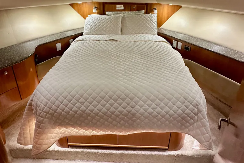 Slide: The Image of Luxurious bedroom in 2004 Meridian 580 Pilothouse yacht with elegant bedding. - 144