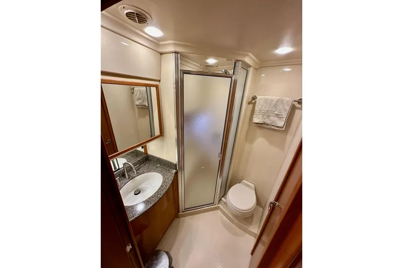 Slide: The Image of Luxurious bathroom in 2004 Meridian 580 Pilothouse yacht with shower, sink, and toilet. - 153