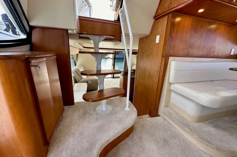 Slide: The Image of Luxurious interior of 2004 Meridian 580 Pilothouse yacht with elegant wooden staircase. - 160