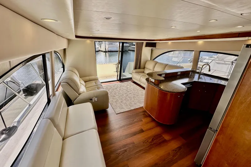 Slide: The Image of Luxurious interior of 2004 Meridian 580 Pilothouse yacht with elegant seating and modern kitchen. - 161