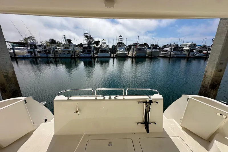 Slide: The Image of 2004 Meridian 580 Pilothouse yacht docked at marina with other boats. - 164