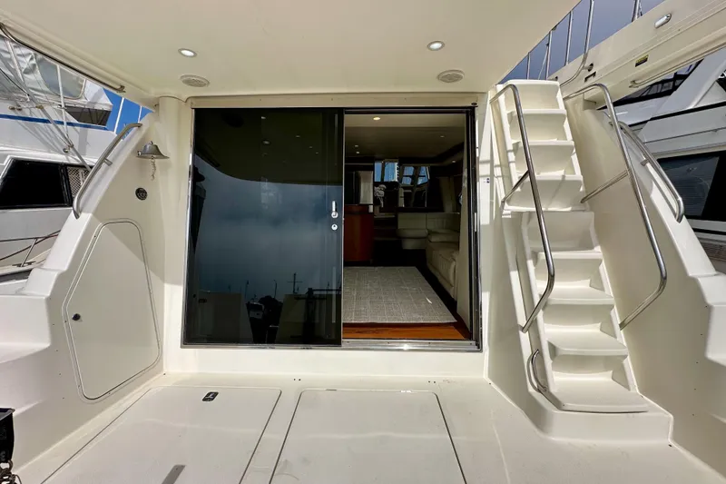 Slide: The Image of 2004 Meridian 580 Pilothouse yacht with open sliding door and staircase. - 19