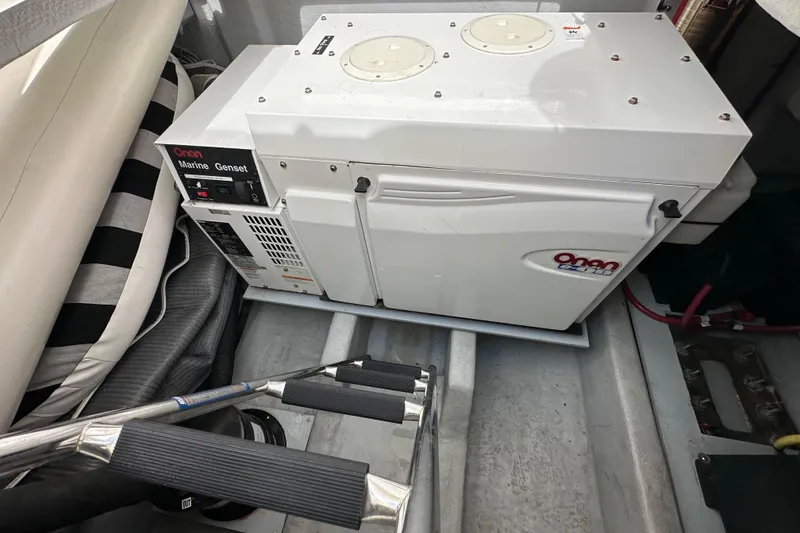 Slide: The Image of Onan marine generator in a 2004 Meridian 580 Pilothouse engine room. - 21