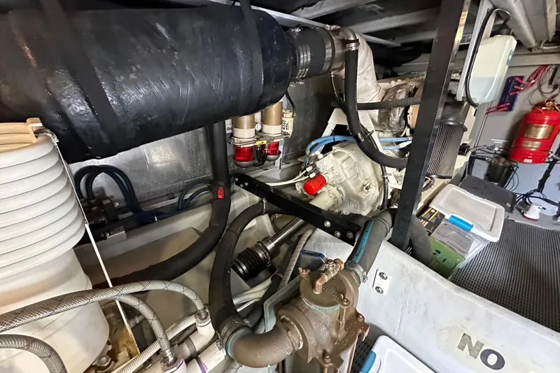 Slide: The Image of Engine room of 2004 Meridian 580 Pilothouse with visible components and fire extinguisher. - 31