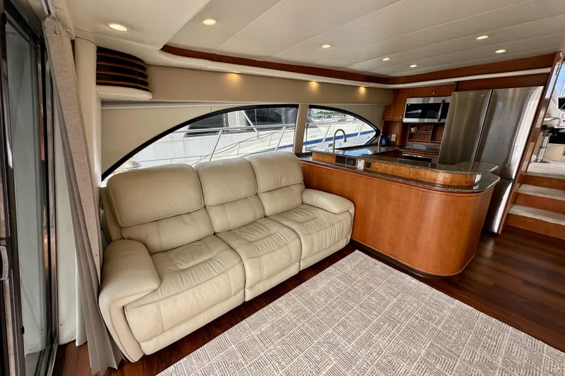 Slide: The Image of Luxurious interior of 2004 Meridian 580 Pilothouse yacht with leather sofa and modern kitchen. - 43