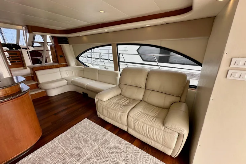 Slide: The Image of Luxurious interior of 2004 Meridian 580 Pilothouse yacht with leather seating and wood flooring. - 44