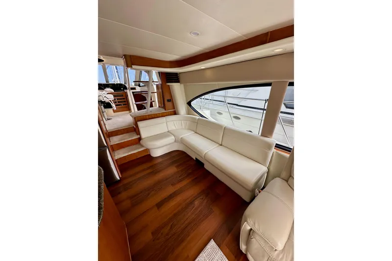 Slide: The Image of Luxurious interior of 2004 Meridian 580 Pilothouse with white leather seating and wooden flooring. - 45
