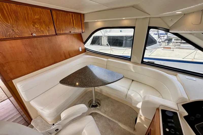 Slide: The Image of Luxurious interior of 2004 Meridian 580 Pilothouse with elegant seating and table. - 60
