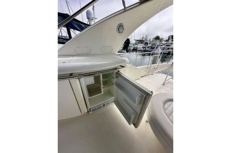 Slide: The Image of Open fridge on 2004 Meridian 580 Pilothouse yacht deck, marina background. - 73