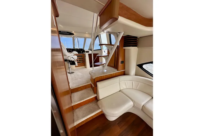 Slide: The Image of Luxurious interior of 2004 Meridian 580 Pilothouse yacht with elegant seating and helm station. - 86