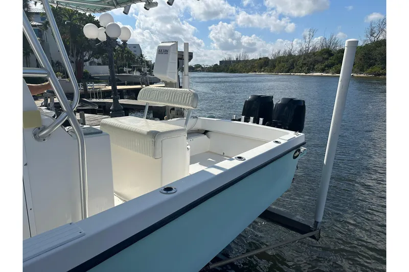 Slide: The Image of 2008 Dusky 278 Center Console boat docked by a scenic river. - 23