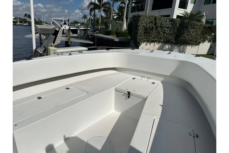 Slide: The Image of 2008 Dusky 278 Center Console boat docked near waterfront property. - 27
