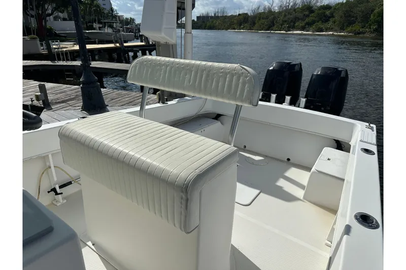 Slide: The Image of 2008 Dusky 278 Center Console boat interior with seating and dual outboard motors. - 28
