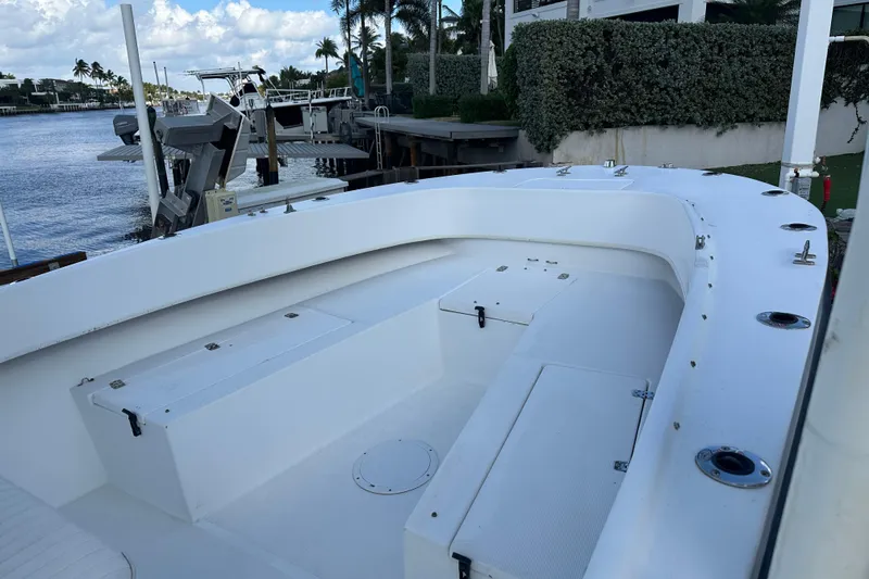 Slide: The Image of 2008 Dusky 278 Center Console boat docked by waterfront with clear sky. - 29