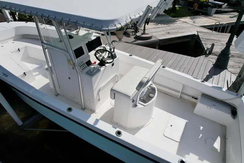 Slide: The Image of 2008 Dusky 278 Center Console boat with spacious deck and modern helm station. - 5