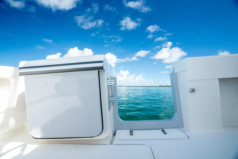 Slide: The Image of 2024 SeaVee 400Z boat deck with ocean view under clear blue sky. - 17