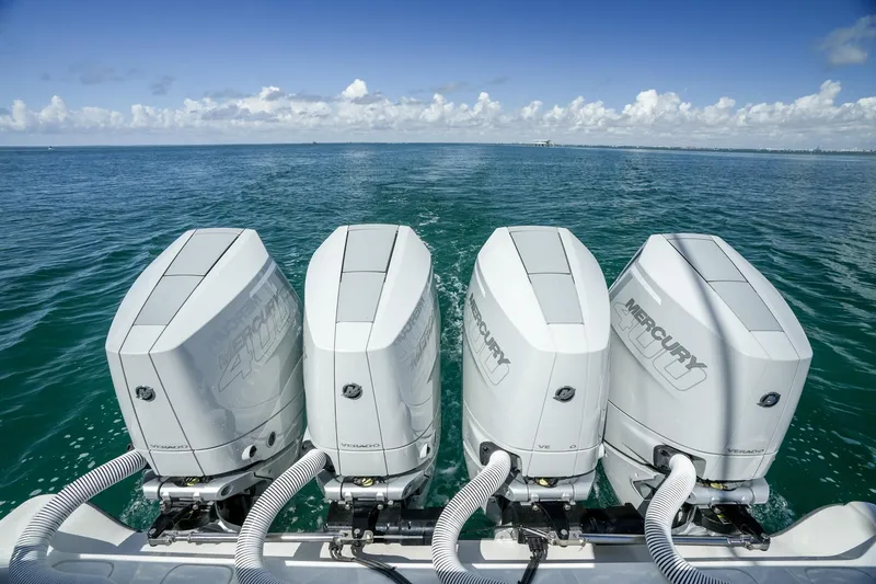 Slide: The Image of Four Mercury outboard engines on a 2024 SeaVee 400Z boat in open water. - 18