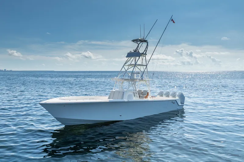 Slide: The Image of Aerial view of 2024 SeaVee 400Z boat cruising on green water. - 24