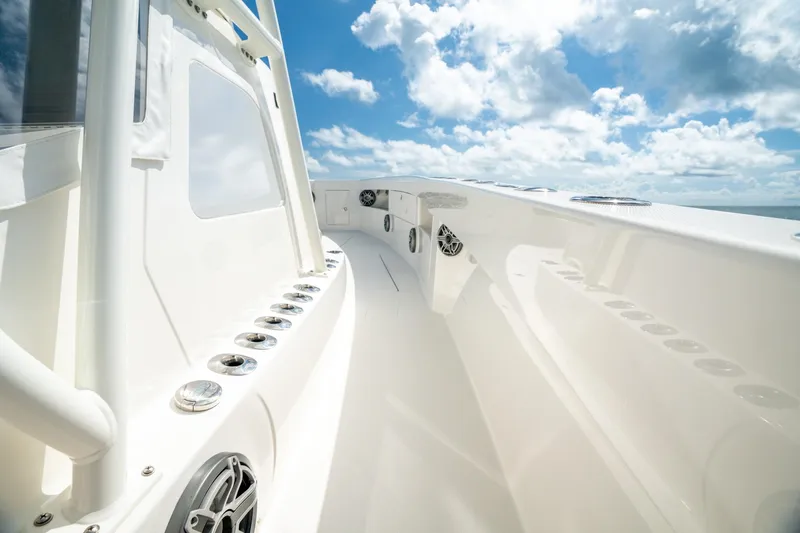 Slide: The Image of 2024 SeaVee 400Z boat deck with sleek design under a bright blue sky. - 4