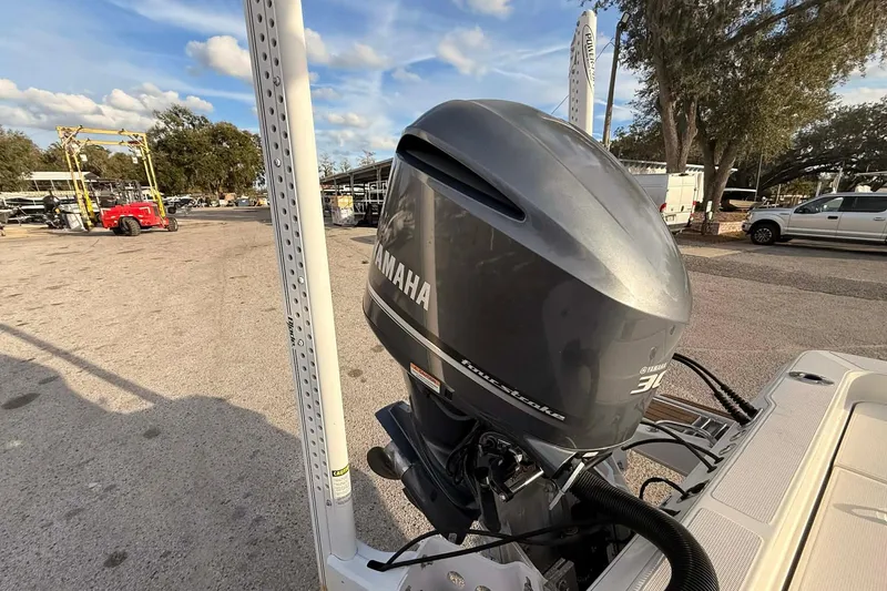 Slide: The Image of 2019 Ranger 2510 Bay Ranger with Yamaha outboard motor in a marina setting. - 14
