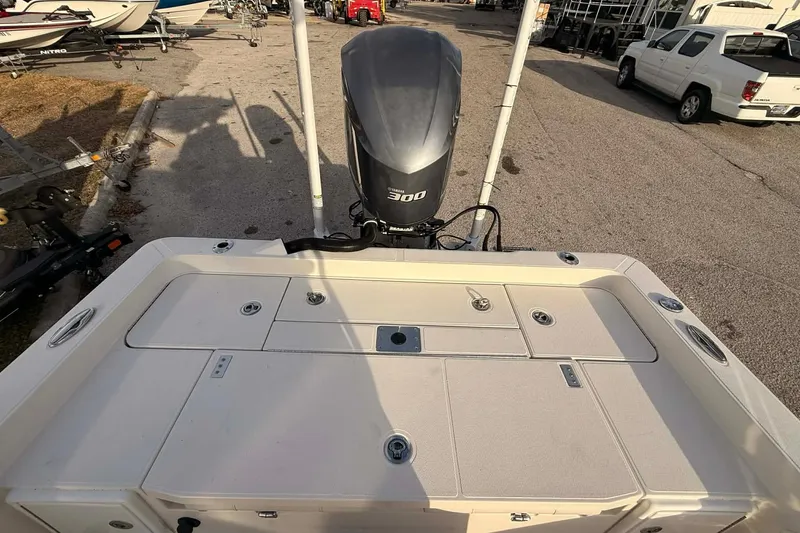 Slide: The Image of 2019 Ranger 2510 Bay Ranger boat with powerful 300 horsepower engine, parked outdoors. - 15