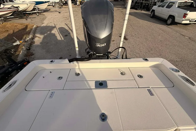 Slide: The Image of 2019 Ranger 2510 Bay Ranger boat with powerful 300 horsepower engine, parked on gravel. - 6