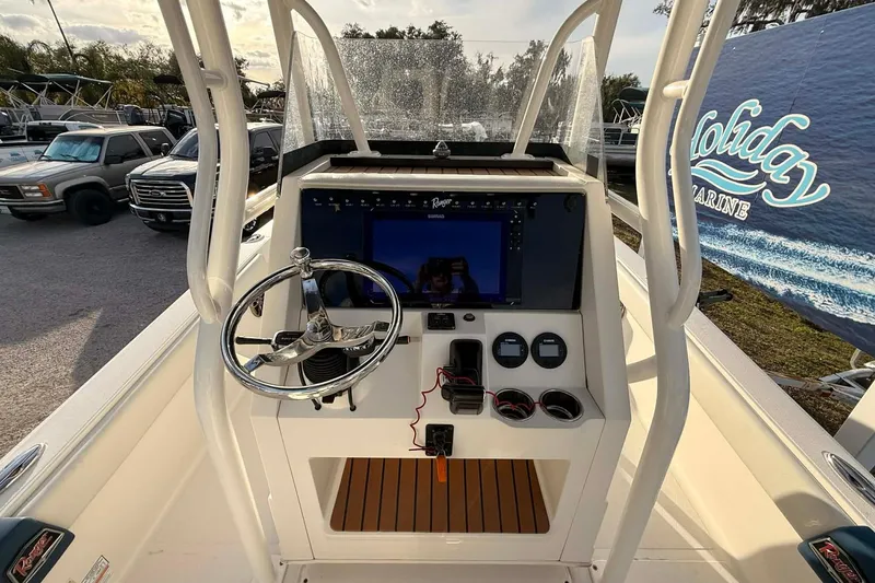 Slide: The Image of 2019 Ranger 2510 Bay Ranger boat console with steering wheel and navigation display. - 9